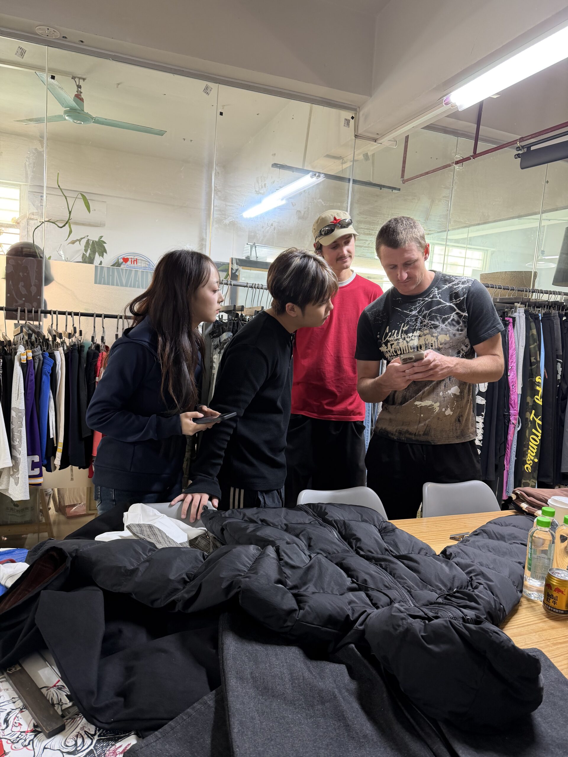 Client checking denim quality at custom clothing manufacturer JiuvelWear