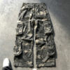 Vintage washed camo canvas cargo pants white background