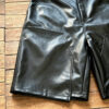 IMG_20260727_175510 Model wearing embroidered double layer leather shorts